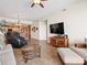 Spacious living area with open floor plan and comfortable furniture, including massage chair at 17735 Gulf Blvd # 204, Redington Shores, FL 33708