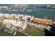 Stunning aerial view of waterfront condos with a marina, showcasing the beautiful coastal community and surrounding area at 188 Brightwater Dr # 2, Clearwater Beach, FL 33767
