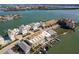 Lovely aerial shot of waterfront condos, showing the marina and beautiful coastline with gorgeous water views at 188 Brightwater Dr # 2, Clearwater Beach, FL 33767