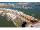 An expansive aerial view captures the waterfront condominiums, complemented by a picturesque marina and beautiful coastline at 188 Brightwater Dr # 2, Clearwater Beach, FL 33767