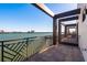 Large balcony with waterfront views and modern metal railings and tile flooring for outdoor enjoyment at 188 Brightwater Dr # 2, Clearwater Beach, FL 33767