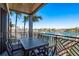 Balcony featuring a table and chairs with serene waterfront views at 188 Brightwater Dr # 2, Clearwater Beach, FL 33767