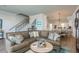 Open concept floor plan with a living room, staircase, and kitchen at 188 Brightwater Dr # 2, Clearwater Beach, FL 33767