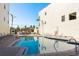 Community swimming pool surrounded by lounge chairs and well maintained landscaping at 188 Brightwater Dr # 2, Clearwater Beach, FL 33767