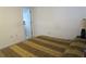 Bedroom with a patterned brown and tan bedspread, simple decor, and an open doorway at 1950 59Th N Ave # 212, St Petersburg, FL 33714