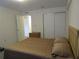 Bedroom with ample closet space, ceiling fan, and neutral carpet at 1950 59Th N Ave # 212, St Petersburg, FL 33714