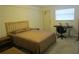 Bedroom features desk, ceiling fan, and natural light at 1950 59Th N Ave # 212, St Petersburg, FL 33714