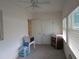 Bright bedroom with ceiling fan, two closets, and neutral carpet at 1950 59Th N Ave # 212, St Petersburg, FL 33714