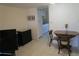 Dining room with tile flooring, a dining table with two chairs, and a view into the kitchen at 1950 59Th N Ave # 212, St Petersburg, FL 33714