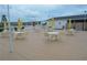 Outdoor patio features tables with chairs with a covered seating area and a view of the property at 1950 59Th N Ave # 212, St Petersburg, FL 33714