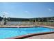 Community swimming pool with lounge chairs, clear water and views of the community lake at 1950 59Th N Ave # 212, St Petersburg, FL 33714