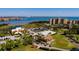 Aerial view of waterfront condos, golf course, and St. Pete skyline in the background at 2617 Cove Cay Dr # 710, Clearwater, FL 33760