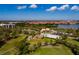 An aerial view shows the golf course with manicured greens and lakes at 2617 Cove Cay Dr # 710, Clearwater, FL 33760