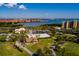 An aerial view shows the golf course with manicured greens, lakes, and condos at 2617 Cove Cay Dr # 710, Clearwater, FL 33760