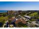 Aerial view of waterfront condos, golf course, and St. Pete skyline in the background at 2617 Cove Cay Dr # 710, Clearwater, FL 33760