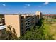 Aerial view of multi-story complex near lake and golf course at 2617 Cove Cay Dr # 710, Clearwater, FL 33760