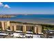 Breathtaking aerial community view of condo buildings, the bay, and mature trees at 2617 Cove Cay Dr # 710, Clearwater, FL 33760