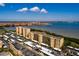 Aerial view of waterfront condos, covered parking, and bay in the background at 2617 Cove Cay Dr # 710, Clearwater, FL 33760