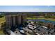 Aerial view of multi-story complex near lake and golf course at 2617 Cove Cay Dr # 710, Clearwater, FL 33760