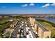 An aerial view shows the condos with covered parking, landscaping, and golf course views at 2617 Cove Cay Dr # 710, Clearwater, FL 33760