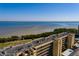 A high-angle view of a building by the water showing the rooftop and balconies at 2617 Cove Cay Dr # 710, Clearwater, FL 33760