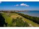 Overhead view of the community's waterfront with lush green spaces and walkways at 2617 Cove Cay Dr # 710, Clearwater, FL 33760