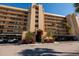 Building entrance featuring meticulous landscaping, covered parking and well-maintained facade at 2617 Cove Cay Dr # 710, Clearwater, FL 33760