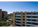 Exterior view of a condo building highlighting large windows and building architecture at 2617 Cove Cay Dr # 710, Clearwater, FL 33760