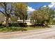 Exterior shot with mature trees and landscaping at 2617 Cove Cay Dr # 710, Clearwater, FL 33760