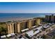 Exterior view of the condo building with covered parking and view of the bay at 2617 Cove Cay Dr # 710, Clearwater, FL 33760