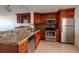 Kitchen featuring stainless steel appliances and tiled floors at 2617 Cove Cay Dr # 710, Clearwater, FL 33760