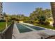 Outdoor shuffleboard courts surrounded by mature trees and lush landscaping at 2617 Cove Cay Dr # 710, Clearwater, FL 33760