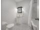 Bright bathroom with subway tile, black and white mosaic floor, and classic fixtures at 311 W Chelsea St, Tampa, FL 33603