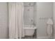 Clawfoot bathtub with white subway tile and vintage-style fixtures at 311 W Chelsea St, Tampa, FL 33603