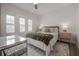 Comfortable bedroom with neutral colors, wood floor, a large bed, and natural light at 311 W Chelsea St, Tampa, FL 33603