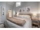 Cozy bedroom with a bed, three framed photos, and two end tables with lamps at 311 W Chelsea St, Tampa, FL 33603