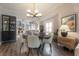 Elegant dining room with stylish lighting, hardwood floors, and views into the kitchen and living areas at 311 W Chelsea St, Tampa, FL 33603