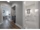 Hallway with access to an office space and a bathroom with classic black-and-white tile at 311 W Chelsea St, Tampa, FL 33603