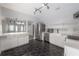 Bright kitchen features hexagon tile, stainless appliances, peninsula with white marble countertop at 311 W Chelsea St, Tampa, FL 33603