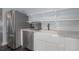 Kitchen features stainless steel appliances, white apron sink, and hexagon tile flooring at 311 W Chelsea St, Tampa, FL 33603