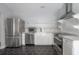 Bright kitchen features stainless appliances, apron front sink, hexagon tile floor, and subway tile backsplash at 311 W Chelsea St, Tampa, FL 33603
