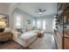 Bright living room with hardwood floors, a plush white sofa, and large windows with stylish white shutters at 311 W Chelsea St, Tampa, FL 33603