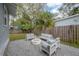 Relaxing patio with modern furniture and a fire pit at 311 W Chelsea St, Tampa, FL 33603