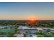 Overhead view of a bustling shopping center at sunset surrounded by lush green trees and blue skies at 3301 Bayshore Blvd # 1806C, Tampa, FL 33629