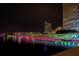 Stunning night view of a waterfront community with illuminated buildings reflecting on the water at 3301 Bayshore Blvd # 1806C, Tampa, FL 33629