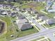 Neighborhood aerial shot showcasing well-maintained lawns, sidewalks, and mature trees at 35661 Jenny Lynne Cir, Zephyrhills, FL 33541