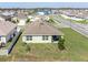 Back view featuring a fenced yard, patio area, and mature landscaping in a residential neighborhood at 35661 Jenny Lynne Cir, Zephyrhills, FL 33541