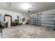 Spacious garage with an automatic door and ample room for storage and parking at 35661 Jenny Lynne Cir, Zephyrhills, FL 33541