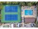 Aerial view of a community pool, tennis courts, boats, and parking at 3710 41St S Way # D, St Petersburg, FL 33711