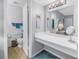 Bright bathroom featuring a vanity area, toilet, and tiled floors at 3710 41St S Way # D, St Petersburg, FL 33711